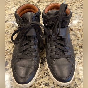 Coach high top sneakers with lock tab.